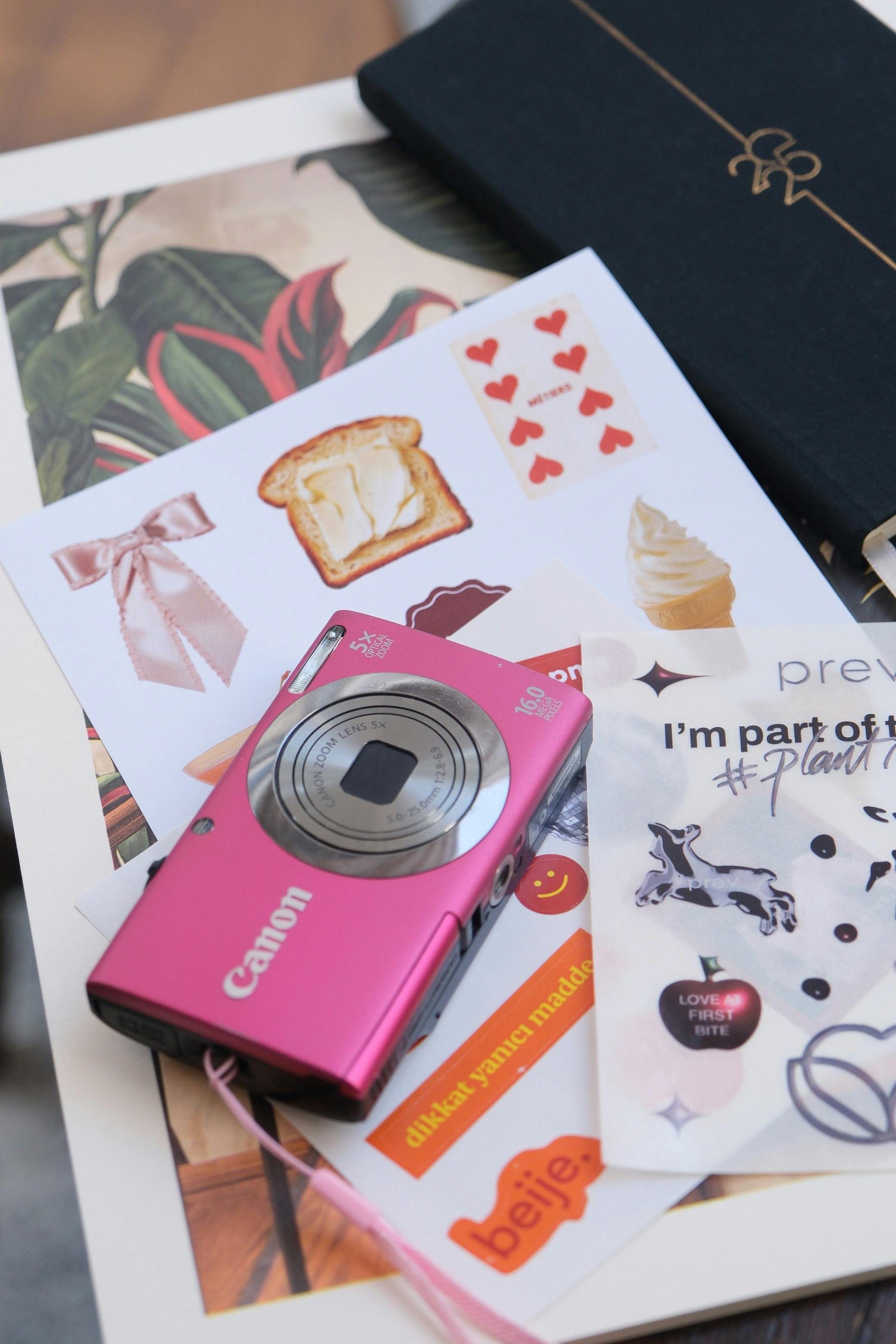Pink camera and stickers used as a sales enablement visual
